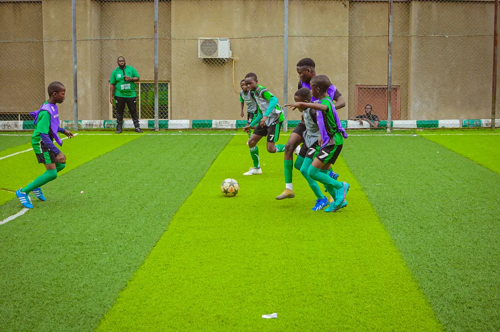 Young players practising in front of the goal